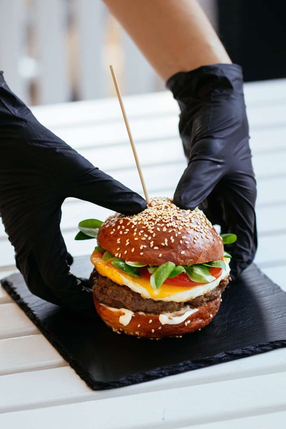 Person holding burger